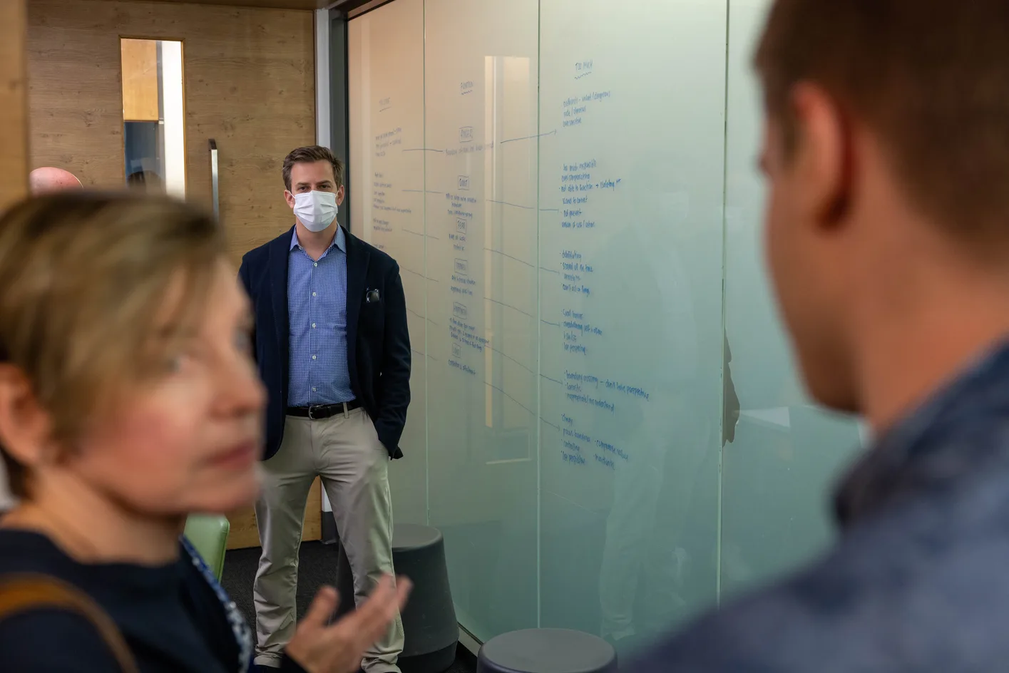 A MindSkiller® clinician talking with a colleague in a clinic.