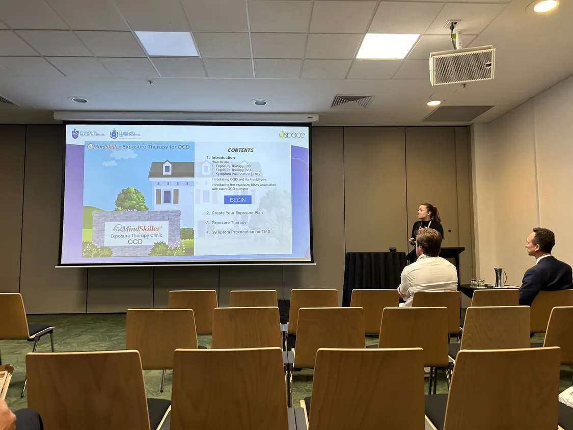 A MindSkiller® presentation to clinicians in a lecture theatre.